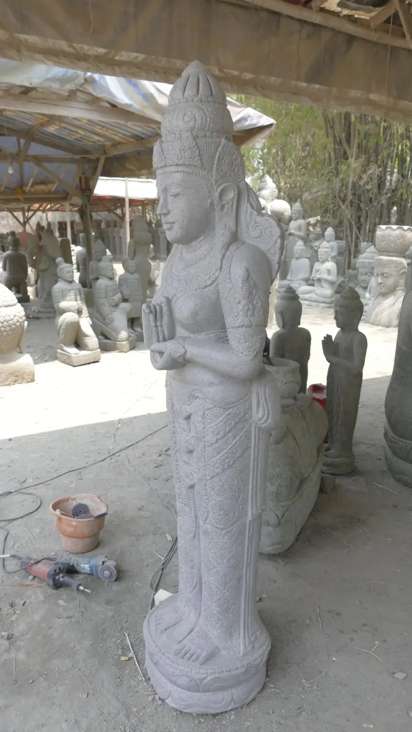  Product image 3 of the product “Standing Sri Dewi. Made from riverstone. Height 180cm ”